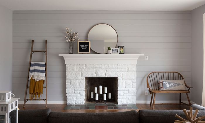 Timeless primed shiplap living room with fireplace